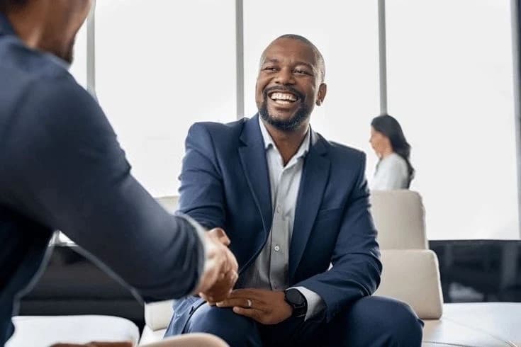 Advisor shaking hands with a client
